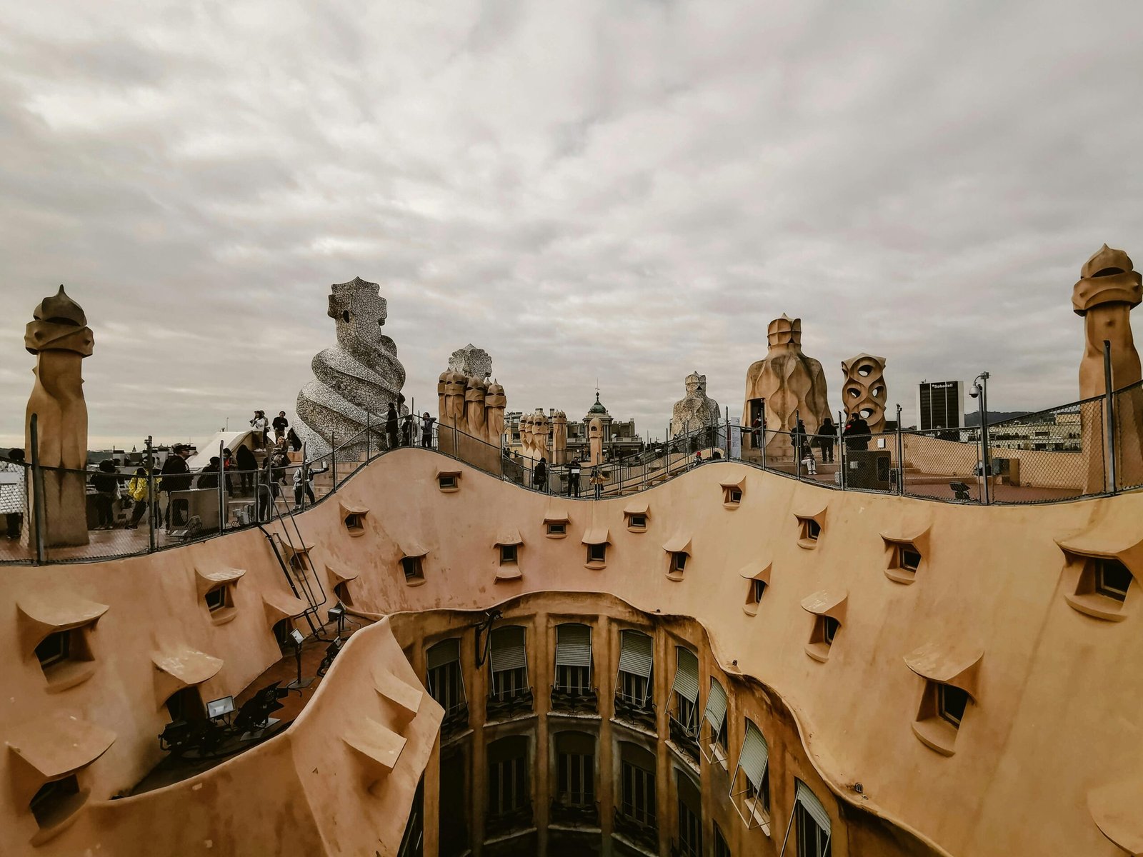 Barcelona rooftop event space hosting a phygital corporate gathering, blending physical networking with digital insights and panoramic city views.